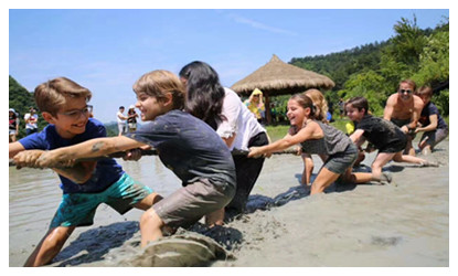 Tourists from France  attend farm activities in Zhangjiajie